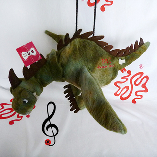 Juguete musical de peluche Dinosaurio de juguete
